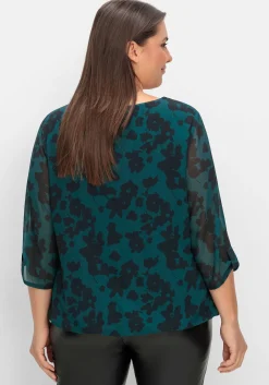 Chiffontunika mit gelegten Falten am Ausschnitt