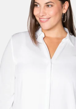 Hemdbluse mit asymmetrischem Saum in Zipfelform