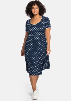 Jerseykleid mit Punktedruck und Paspelierung
