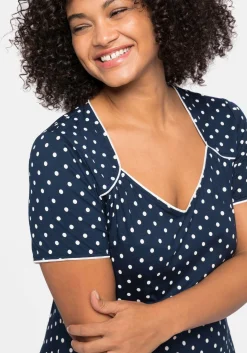 Jerseykleid mit Punktedruck und Paspelierung