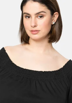 Jerseykleid mit Smok-Ausschnitt und Puffärmeln