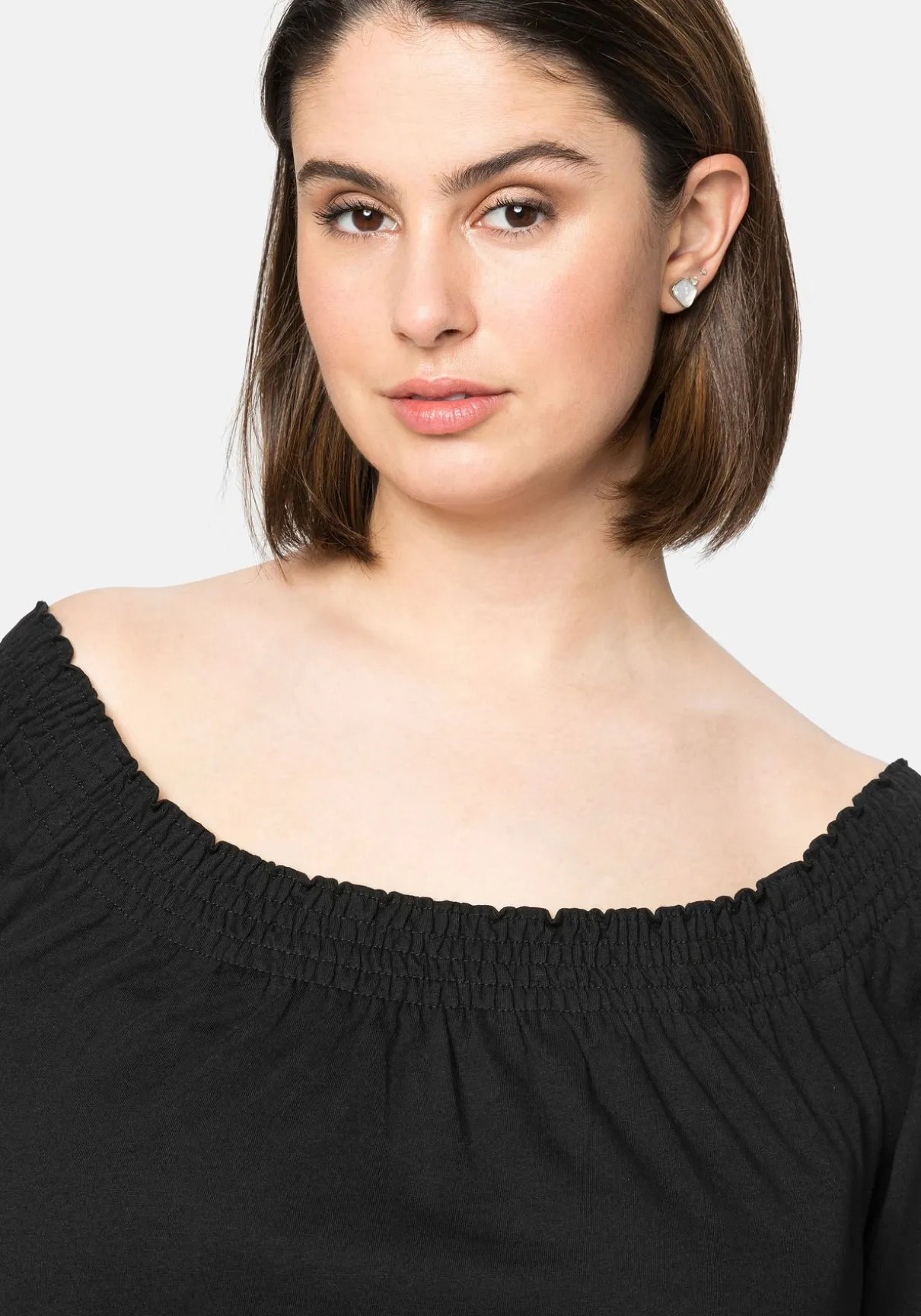 Jerseykleid mit Smok-Ausschnitt und Puffärmeln