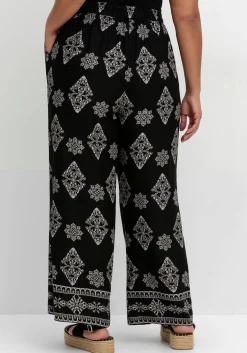 Schlupfhose mit Allover- und Bordürendruck