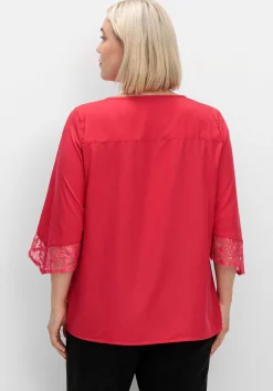 Tunika mit Spitze und Trompetenärmeln