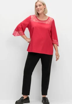 Tunika mit Spitze und Trompetenärmeln